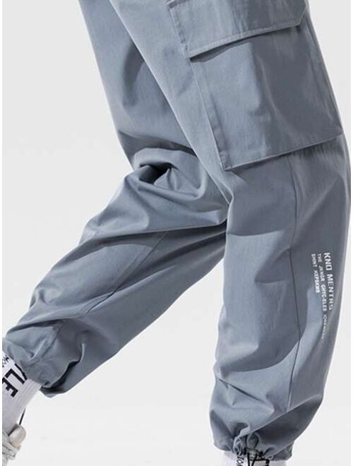 Buy Shein Men Side Flap Pocket Drawstring Hem Cargo Pants online 