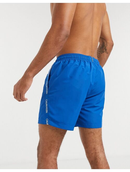 Calvin Klein medium length swim trunks in blue
