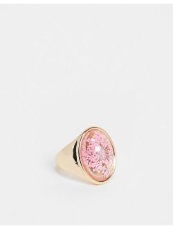 ring with trapped flower in gold tone