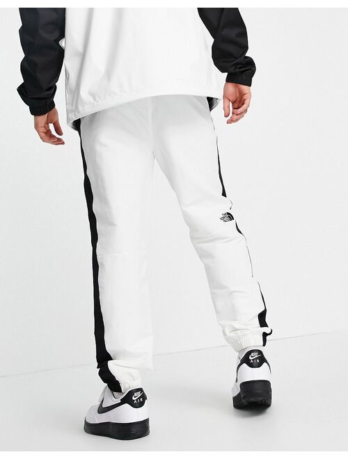The North Face Black Box track pants in white/ black