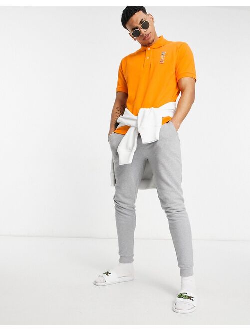 Lacoste x Polaroid Short Sleeve Polo in orange