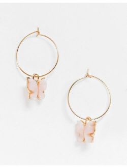 hoop earrings with pink butterfly charm in gold tone