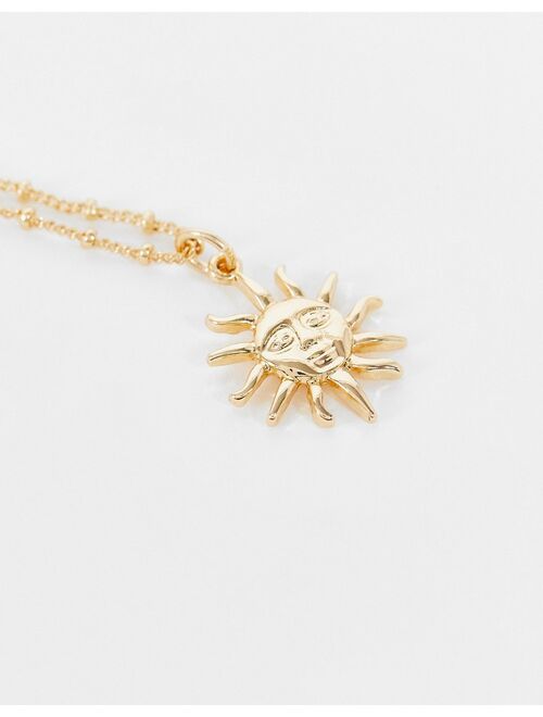 Asos Design necklace with sun pendant in gold tone
