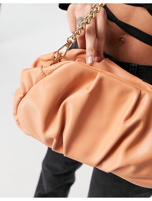 Asos Design oversized ruched clutch bag in apricot with detachable shoulder chain