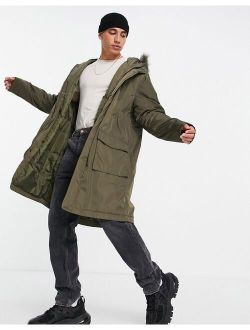 parka jacket in green with faux-fur trim hood