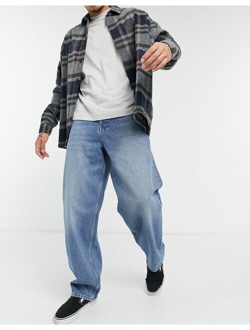 Asos Design ultra baggy jeans in vintage mid wash