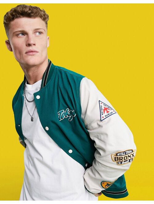 Asos Design oversized varsity cotton bomber jacket in green with embroidery badging