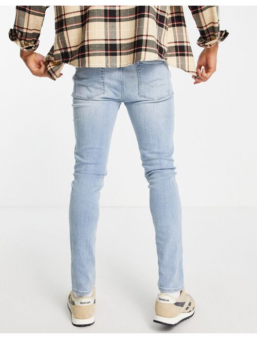 Asos Design skinny jeans in light wash blue