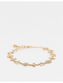 bracelet with celestial design in gold tone