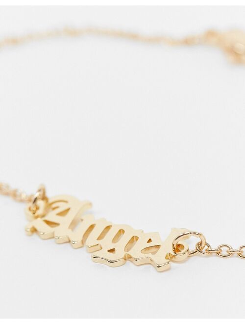 Asos Design chain bracelet with angel gothic font in gold tone