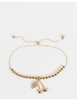 bracelet with cherry charm in gold tone