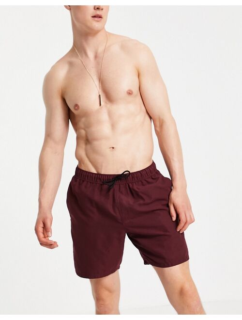 Asos Design swim shorts in burgundy mid length