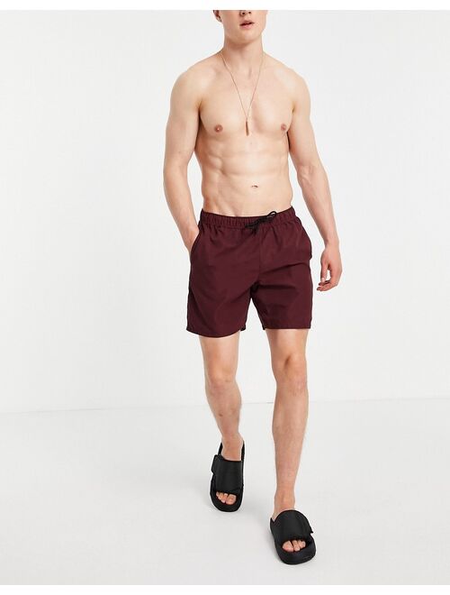 Asos Design swim shorts in burgundy mid length