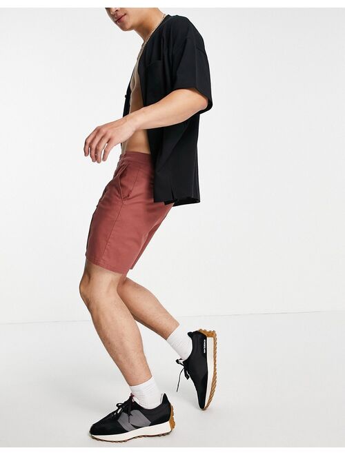 Asos Design skinny chino shorts with pin tuck in rust red