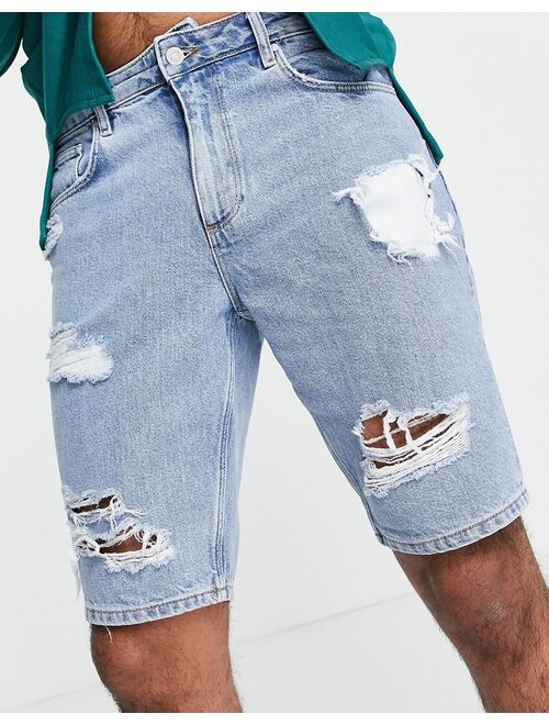 Asos Design slim denim shorts in vintage mid wash with heavy rips