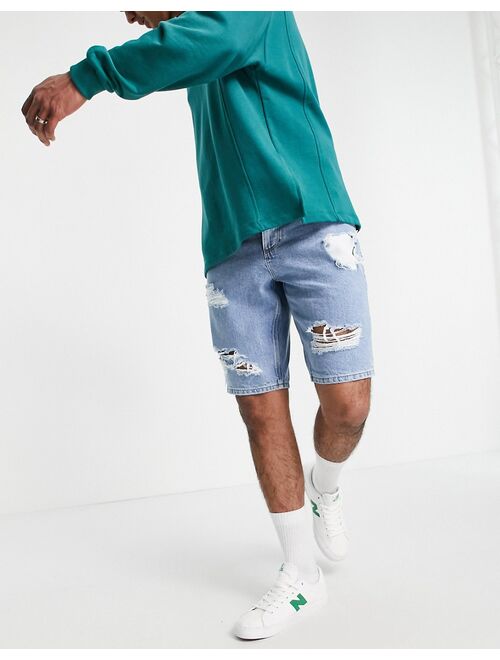 Asos Design slim denim shorts in vintage mid wash with heavy rips