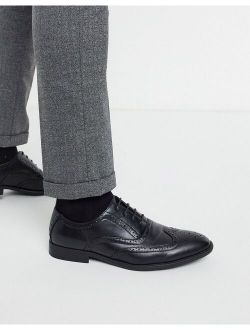brogue shoes in black faux leather