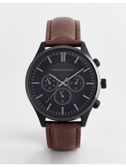 classic watch with contrast black case and mock croc strap in brown