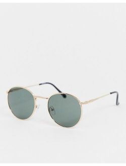 round sunglasses in gold with nose bridge detail