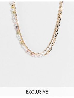 inspired multirow necklace with mixed chain and pastel faux pearls in gold