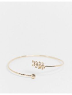 cuff bracelet with delicate leaf and ball detail in gold tone