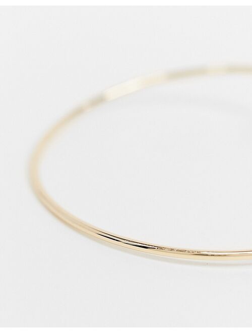 Asos Design cuff bracelet with delicate leaf and ball detail in gold tone