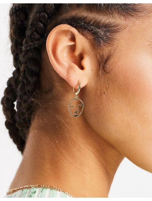 Asos Design hoop earrings with abstract face charm in gold tone