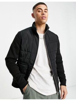 Premium quilted jacket with knitted sleeves in black