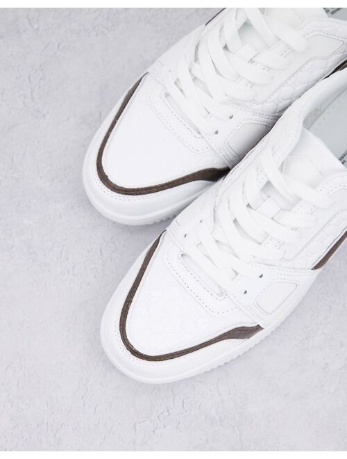 River Island low top monogrammed sneakers in white
