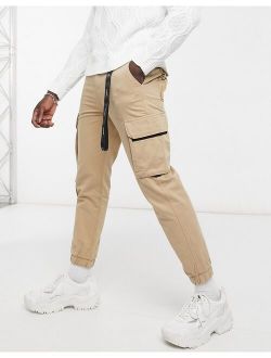 cargo pants with key chain in camel