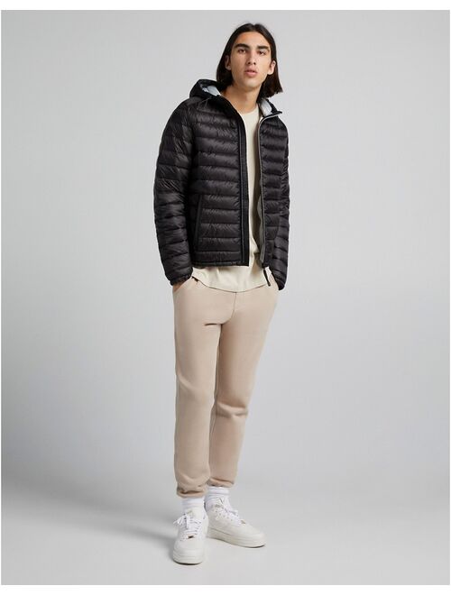 Bershka quilted hooded jacket in black