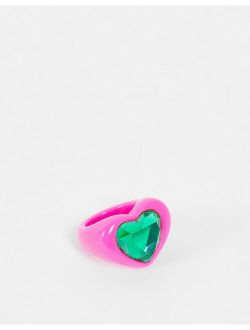 ring in heart shape with emerald green jewel in hot pink plastic
