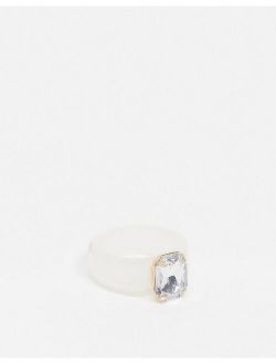 plastic ring in white with clear crystal stone