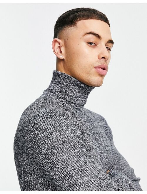 Asos Design muscle fit ribbed rollneck sweater in black and white twist