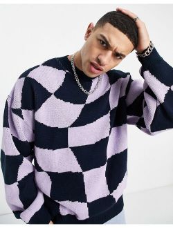 oversized knitted sweater with warped checkerboard in navy and lilac