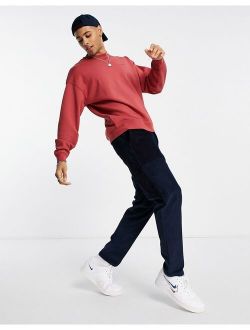 red tab crew sweatshirt with small logo in garment dye marsala red