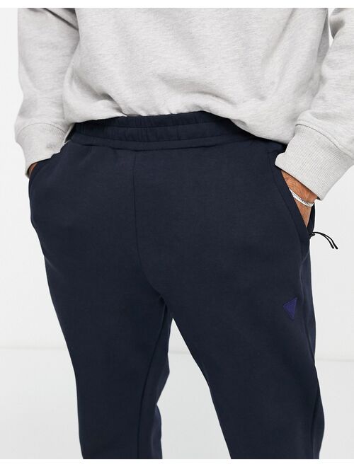 Guess active cuffed sweatpants with leg logo in navy