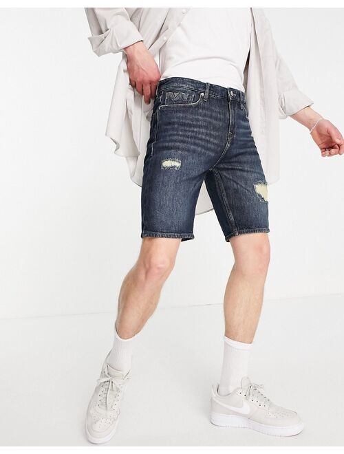 Guess distressed denim shorts in light blue wash