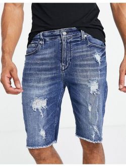 denim shorts with abraisions in light blue wash