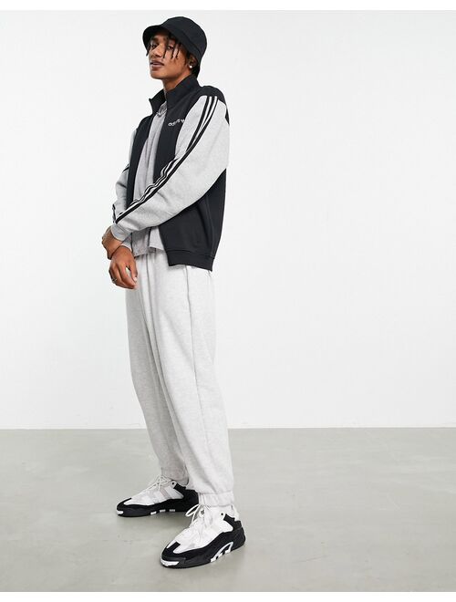 Adidas Originals Originals SPRT fleece track top in black and gray