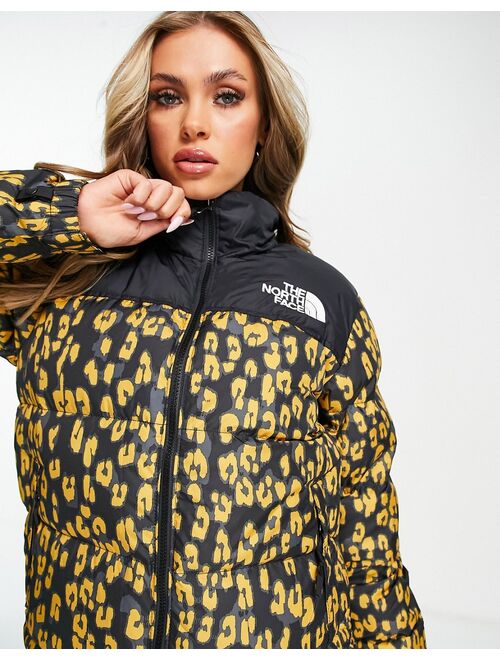 The North Face 1996 Retro Nuptse leopard print jacket in black/yellow