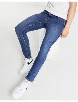 skinny jeans in mid blue