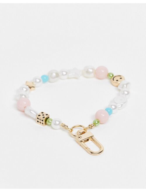 ASOS DESIGN bag charm with dice and happy face in pastel colors