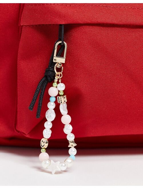 ASOS DESIGN bag charm with dice and happy face in pastel colors