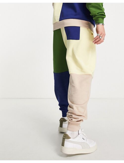 ASOS Actual relaxed sweatpants in color block with logo print in beige - part of a set