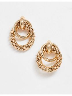 earrings in linked sleek and textured circles in gold tone