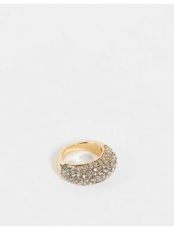 domed ring with clear crystals in gold tone