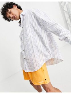 extreme oversized shirt in navy stripe with curved hem