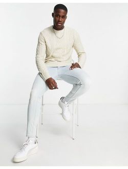 long sleeve cable knit sweater in ecru