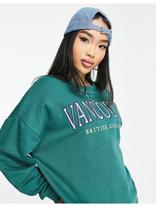 Stradivarius oversized embroidered Vancouver sweat in teal